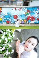 A woman sitting in front of a colorful wall eating ice cream.